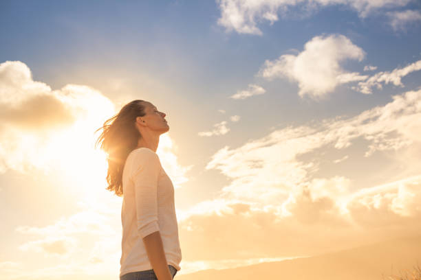 Reclaim Your Worth: 6 Ways Self-Worth Hypnotherapy Heals Feeling Unseen Woman thinking of her future.